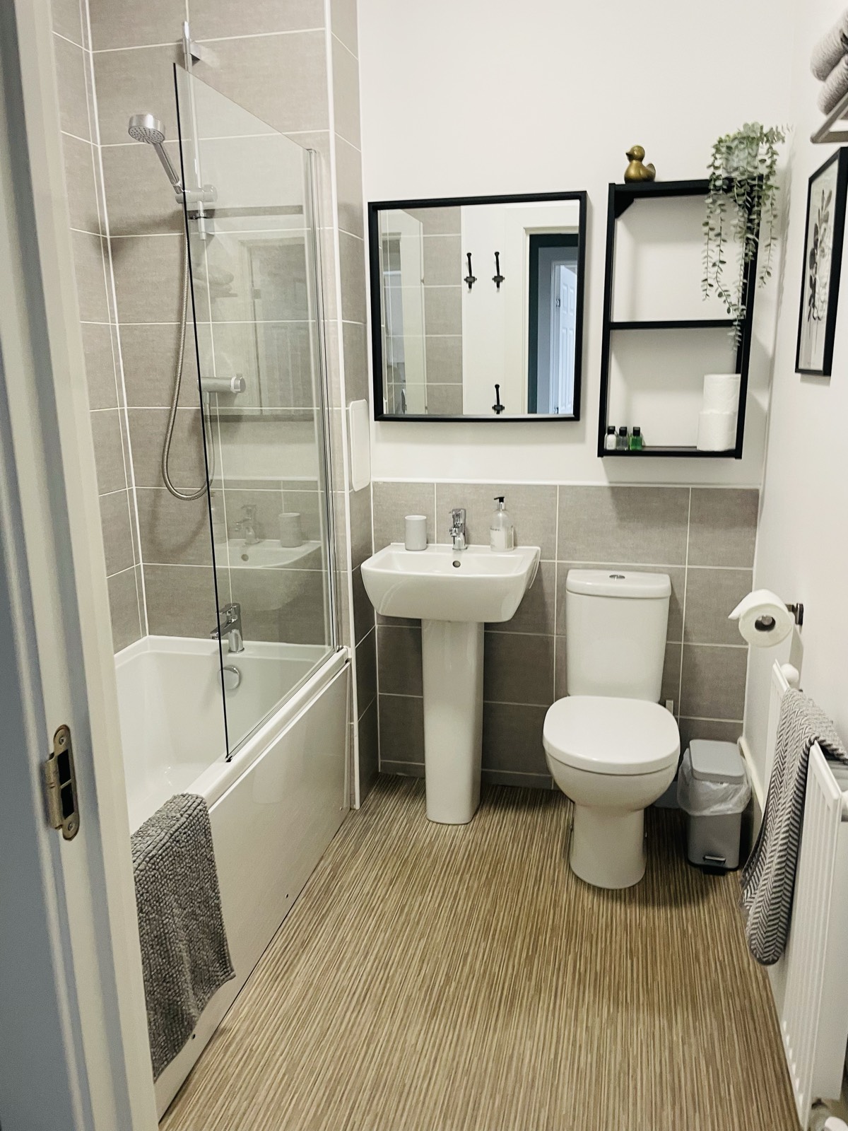 Bathroom with bath and overhead shower