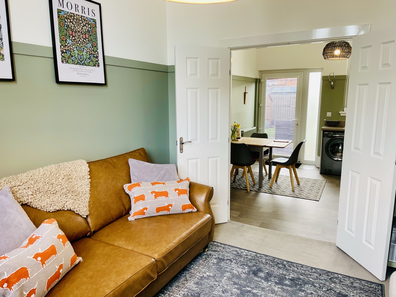 Living room looking through double doors to the dining room and garden door